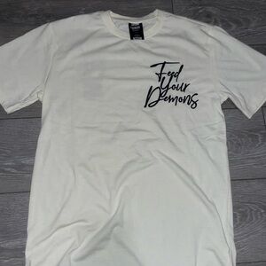Genuine La Tee “Feed ur demons” 
Brand new 
Small slightly oversized fit